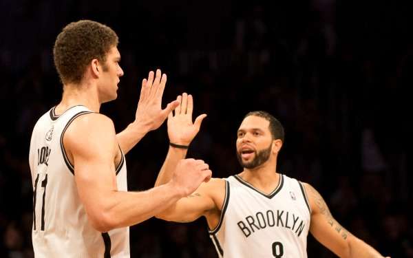 Brook Lopez and Deron Williams have dealt with injury problems all season. (Don Emmert /AFP/Getty Images)